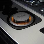 AXE Dark Temptation gel car air freshener placed in a vehicle cup holder showing the embossed AXE top and orange gel ring.