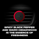 Single AXE red-and-black circular vent clip mounted on a car vent with dark background and scent description text