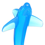Top-front view of a translucent blue shark-shaped silicone infant toothbrush highlighting textured bristle area