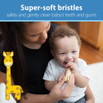Baby held by adult mouthing a giraffe-shaped toothbrush with text promoting super-soft bristles