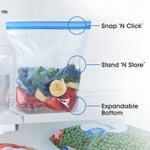 Clear resealable freezer bag filled with fruit on a fridge shelf with callouts for Snap 'N Click, Stand 'N Store, and expandable bottom.