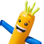 Tilted close-up of the inflatable sprinkler head with smiling face, green sprout details and blue arm