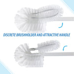 Close-up detail of white dual-brush head showing a smaller inner brush and larger rounded outer bristles with arrows