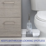 Bath Bliss square toilet brush and stand placed beside a toilet and vanity on a tiled bathroom floor