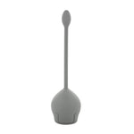 Gray tulip-shaped toilet brush with a long handle standing upright on white background