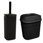 Matte black textured rattan-style toilet brush holder and matching swing-top trash can on white background