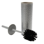 Silver hammered-texture cylindrical holder standing with gray-handled toilet brush laid beside showing black bristles