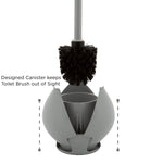 Toilet brush with black bristles lifted above a gray tulip-shaped canister, canister panels opened