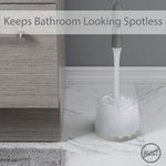 Bath Bliss gray toilet brush in frosted holder placed on bathroom floor with overlay text ‘Keeps Bathroom Looking Spotless’