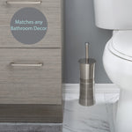 Bath Bliss stainless steel toilet brush and holder styled on bathroom floor beside cabinet and toilet, matches any bathroom decor badge