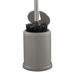 Top view of Bath Bliss grey holder with brush inserted, showing black bristles and hinged lid inside the rim