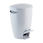 Close-up of a white plastic pedal bin photographed against a white background highlighting the curved lid and pedal