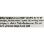Close-up photograph of directions label reading spray directly into the air and storage instructions