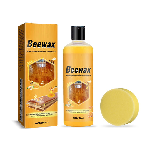 Beewax wood furniture polish bottle with matching box and a round yellow applicator pad on white background