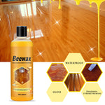 Beewax bottle in front of a glossy polished wood floor with honey drip graphic and hexagon feature icons