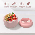 Blush insulated bowl with removable lid and retractable utensils beside bowl of granola and berries, icons above highlight features.