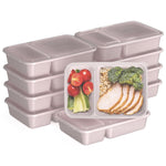 Stack of blush pink two-compartment meal prep containers with clear lids and one filled sample container showing food.