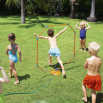 Child running through an orange and blue octagon water sprinkler with other children watching on a lawn.