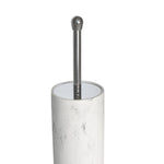 Close-up of a white faux marble cylindrical toilet brush holder showing chrome handle and rim