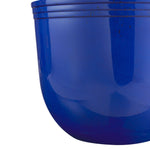 Close-up detail of a glossy blue planter exterior highlighting subtle speckled finish and triple-ribbed rim near the top.