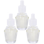 Three clear refill fragrance bottles with white caps arranged on a white background, pale yellow oil visible inside.