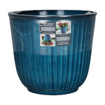 Packaged Better Homes & Gardens aqua ribbed planter wrapped in plastic with product label affixed to side