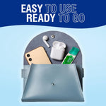 Lifestyle product-in-bag image showing Beyond Breath bottle beside smartphone and wireless earbuds in a purse