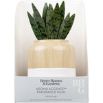 Packaged Better Homes & Gardens Aroma Accents fragrance plug with wood-grain finish and faux snake plant leaves visible in retail box