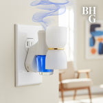 Better Homes & Gardens plug-in diffuser inserted in a wall outlet with a blue fragrance refill producing stylized scent swirls