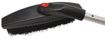 Bigfoot swivel brush head close-up showing dense black bristles and a black plastic housing attached to an aluminum shaft