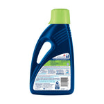 Rear view of a blue BISSELL PET Advanced Stain & Odor bottle showing the back label and safety text