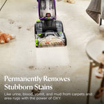 BISSELL upright cleaner revealing cleaned path on dirty carpet with headline about removing stubborn stains