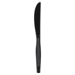 Single black disposable serrated plastic knife on white background, vertical orientation