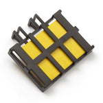 Black plastic cartridge with six yellow rectangular lure pads, photographed on a white background
