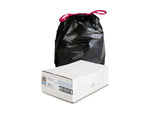 Black trash bag with pinkish-red drawstring standing behind a white cardboard box