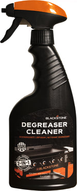 Close-up of a Blackstone Degreaser Cleaner black spray bottle with orange top and product label