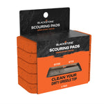 Retail packaging of Blackstone scouring pads showing stacked orange pads inside branded black and orange box.