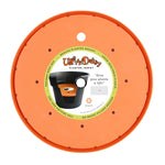 Top-down view of an orange Bloem Ups-A-Daisy planter insert with product label in center.