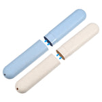 Two speckled cylindrical travel toothbrush cases in blue and beige shown partially separated to show inner fit