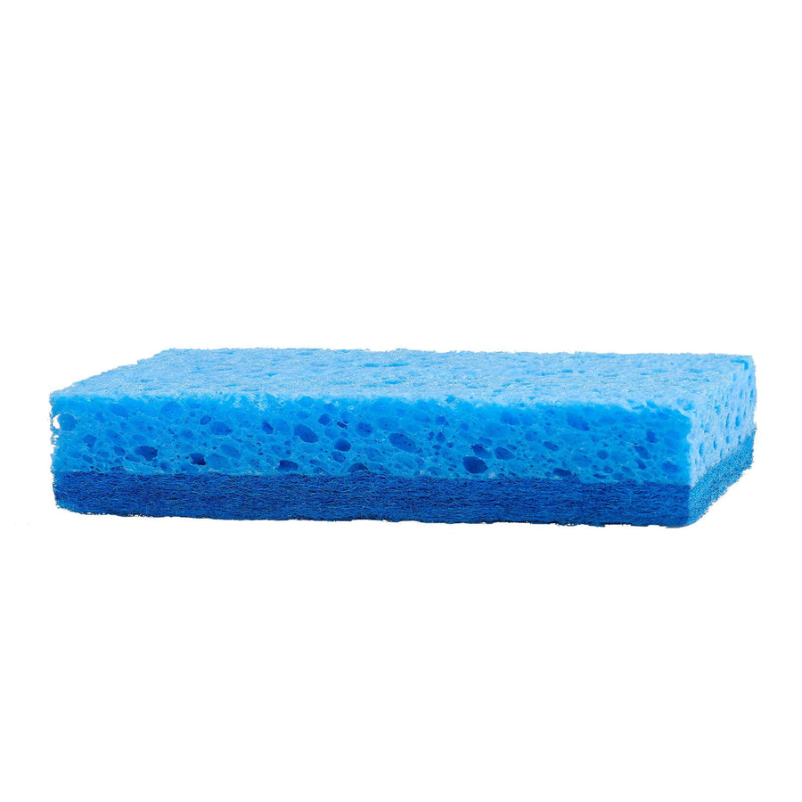 Close-up side view of a blue dual-layer kitchen sponge with porous cellulose top and darker scrub bottom.