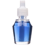 Isolated clear bottle of blue fragrance oil with white cap on a white background, studio product shot