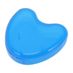 Translucent blue heart-shaped plastic case for storing dental braces or retainers, shown closed on white background.
