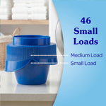 Blue measuring cap shown on a countertop with copy indicating ‘46 Small Loads’ and measurement markings for medium and small loads