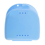 Top-down view of closed blue plastic retainer case showing two rows of vent holes