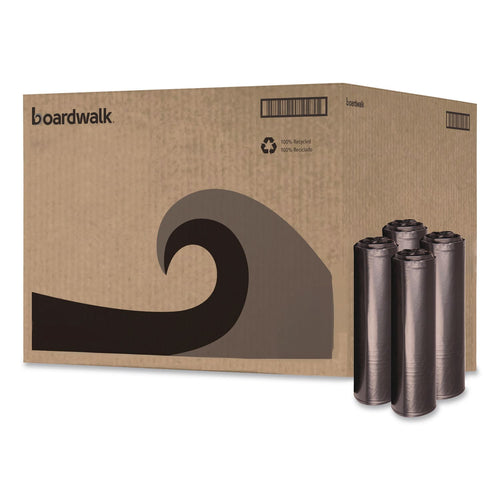 Large corrugated cardboard case with Boardwalk logo and stylized wave graphic, next to four rolled black trash bags.