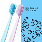 Stylized graphic of blue and light purple toothbrushes with text callout reading “Extra-soft bristles”