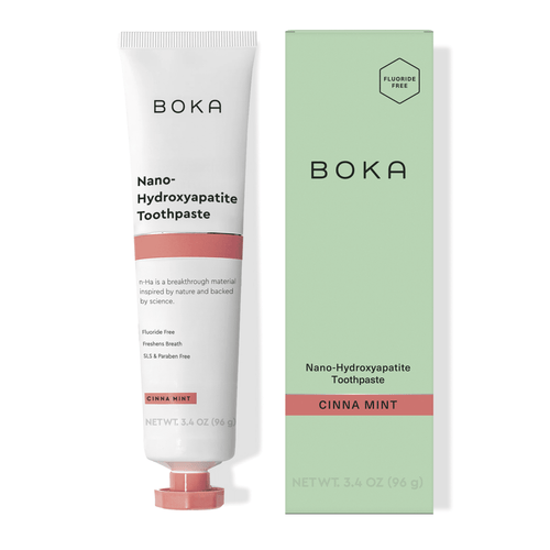 Boka Cinna Mint nano-hydroxyapatite toothpaste tube standing next to its mint-green product box on a white background.