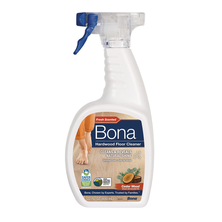 White spray bottle of Bona hardwood floor cleaner with cedar wood label and blue trigger on white background