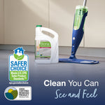 Bona cleaner jug next to a spray mop on a tiled floor with Safer Choice and biobased certification badges