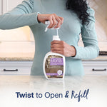 Person twisting open a Bona Pet System spray-top refill bottle on a kitchen counter, label shows cat formulation
